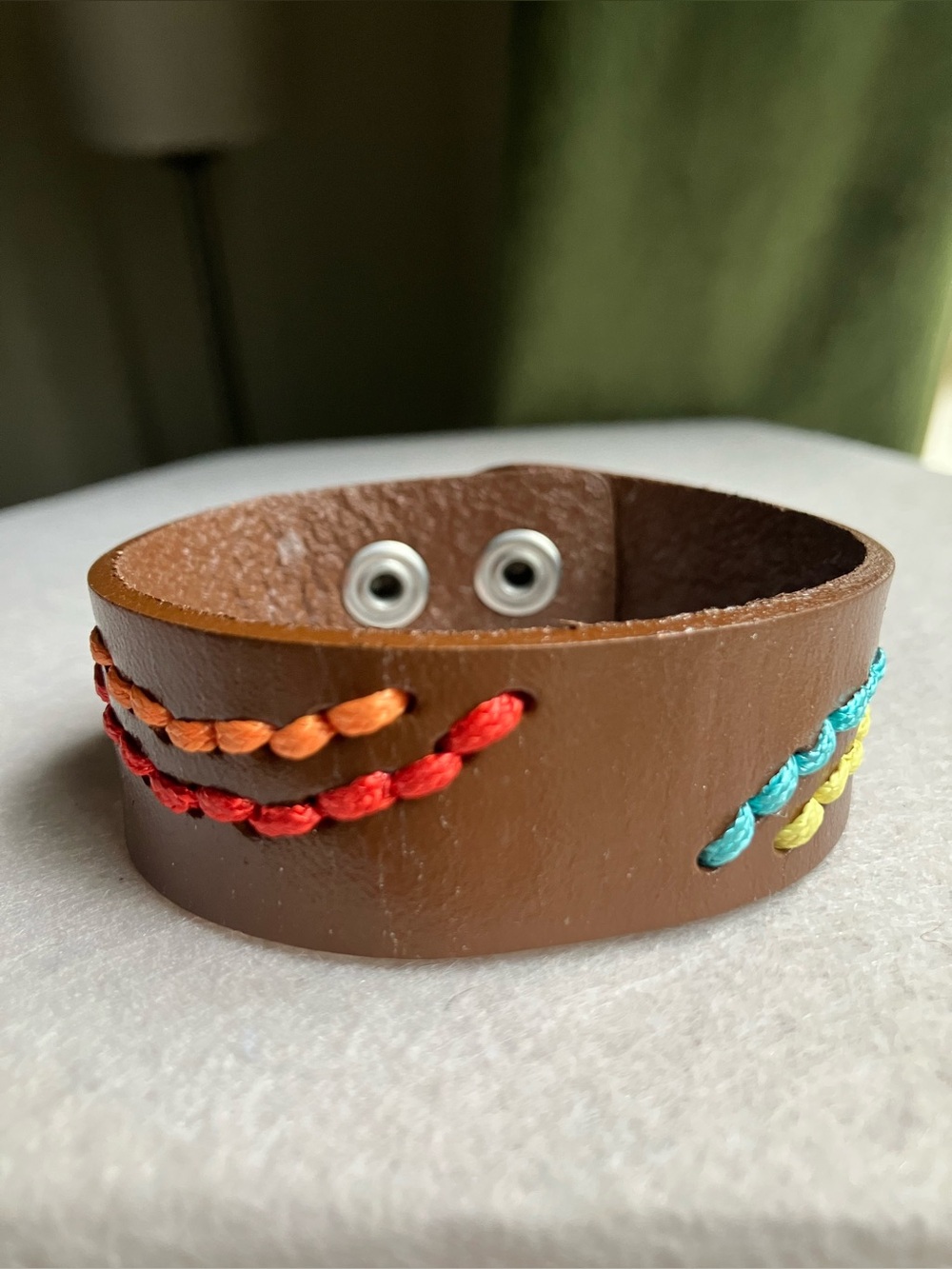 Brown leather snap bracelet with colorful embroidery